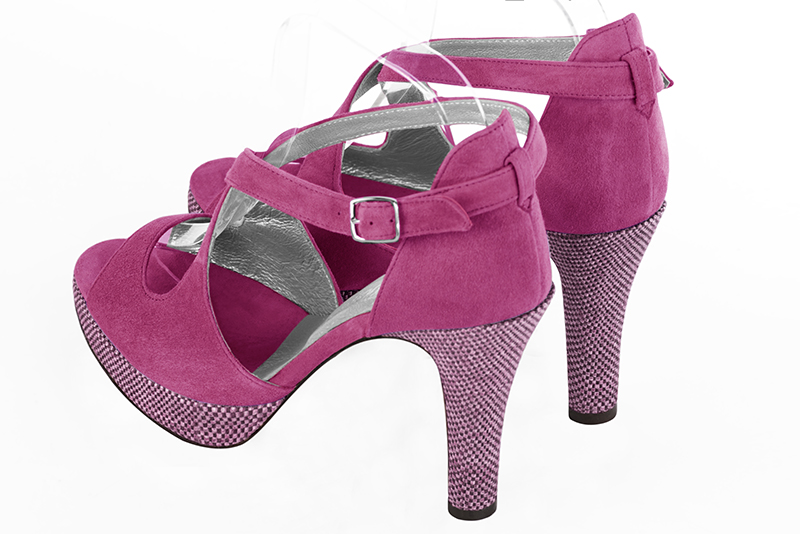 Shocking pink women's closed back sandals, with crossed straps. Round toe. Very high slim heel with a platform at the front. Rear view - Florence KOOIJMAN